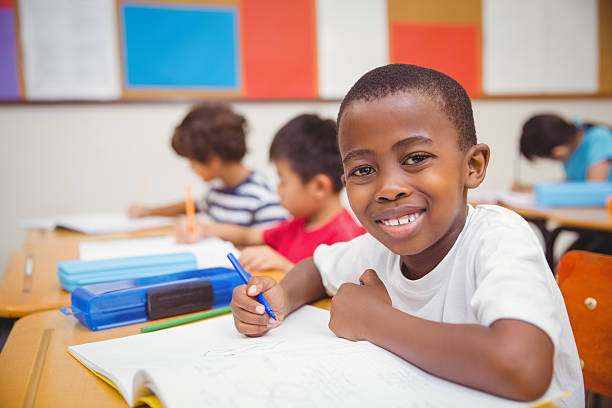istock Cute pupils drawing at their desks 469967756