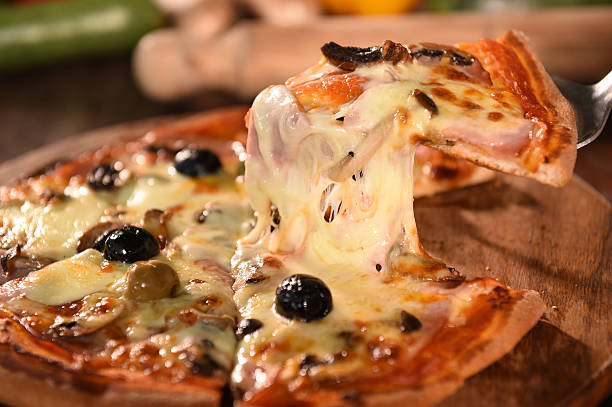 istock pizza on wooden background 469968812