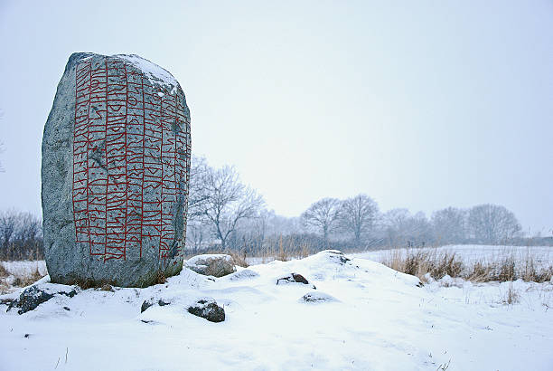 Rune stone in winter land Rune stone in swedish winter landscape. This rune stone is located in Karlevi at the island Oland in Sweden. The Swedish island Oland, the island of sun and wind, is located in the Baltic Sea just off the coast of mainland Sweden. The nature and landscapes of Oland is unique with a special light and a wide range of different nature types. viking ship photos stock pictures, royalty-free photos & images