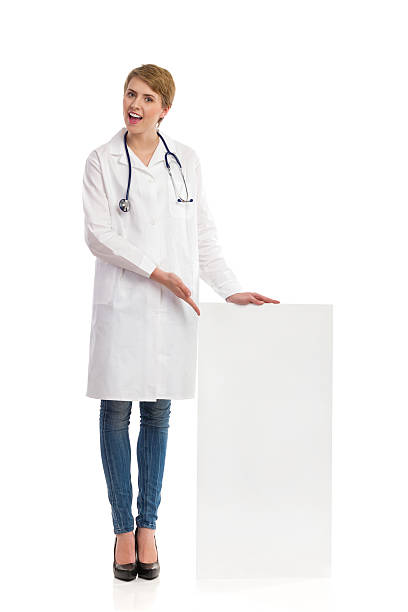 istock Doctor pointing at banner. 469975917