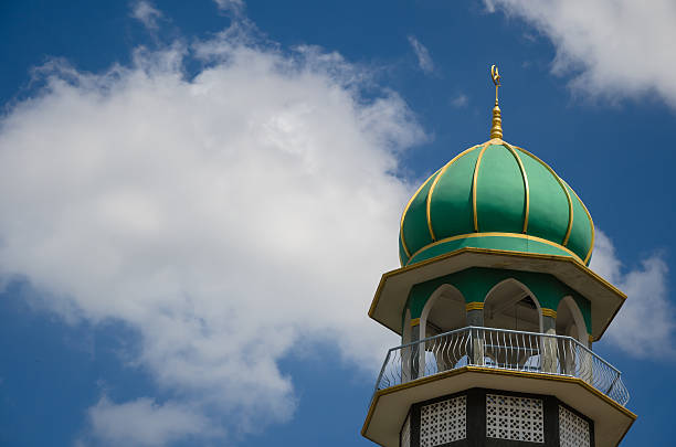 istock Green Dome of Masjid In Blue Sky. 469977276