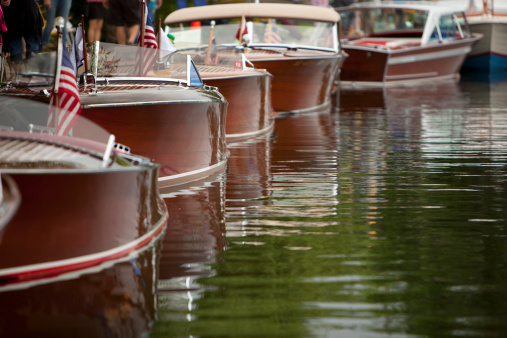 On a busy weekend day, wooden speedboats are docked in downtown Sandpoint, ID.