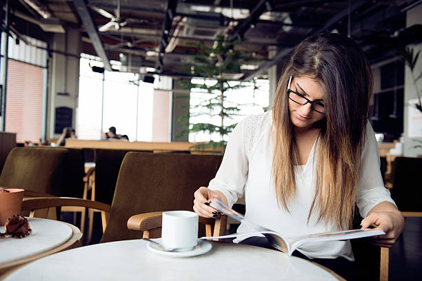 istock The young lady reading a magazine 469981161