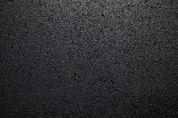 Background of freshly put asphalt on road.