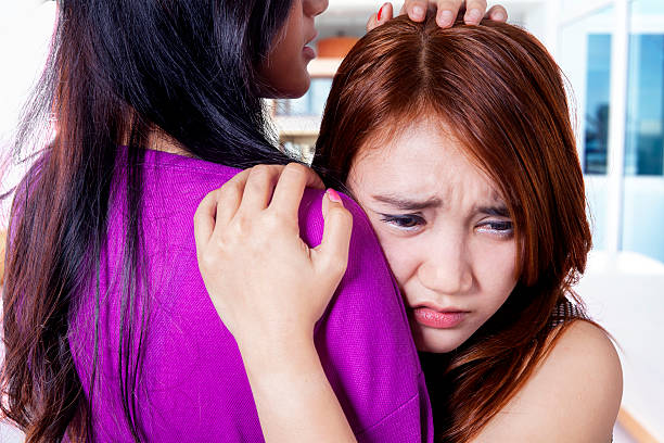istock Sad girl soothed by her friend 469981530