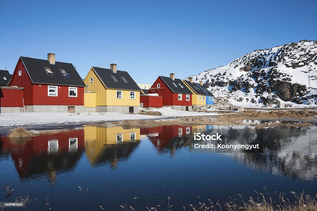 Reflection of colorful houses in Greenland. Reflection of colorful houses in Ilulissat, North Greenland. Greenland Stock Photo