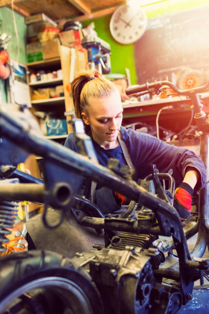 istock Female mechanic working on a custom motorbike 469986354