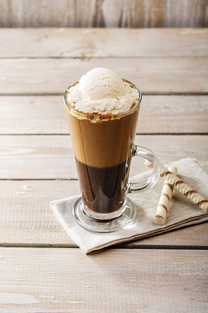 istock cold coffee with ice cream in a glass 469986944