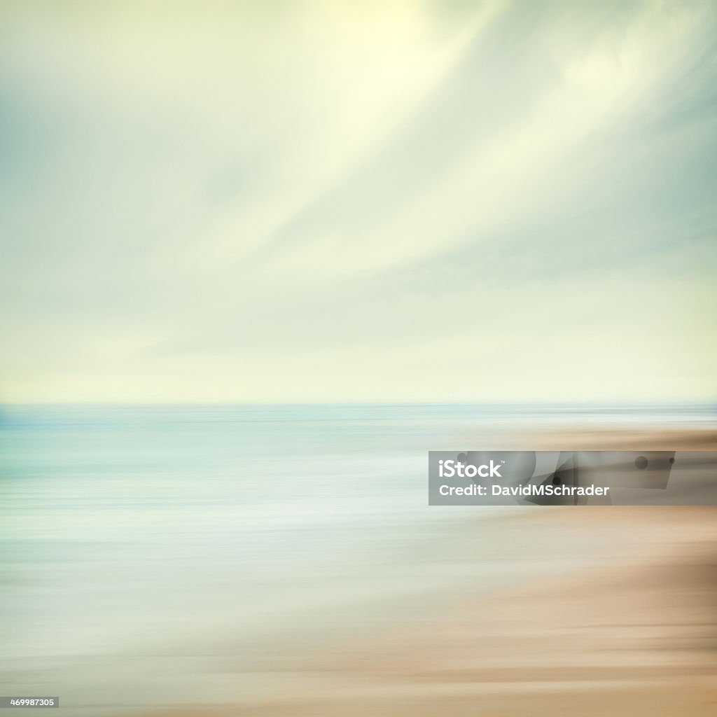 Sea and Sky Abstract A seascape abstract with panning motion combined with a long exposure.  Image displays soft, pastel colors in a retro style. Backgrounds Stock Photo