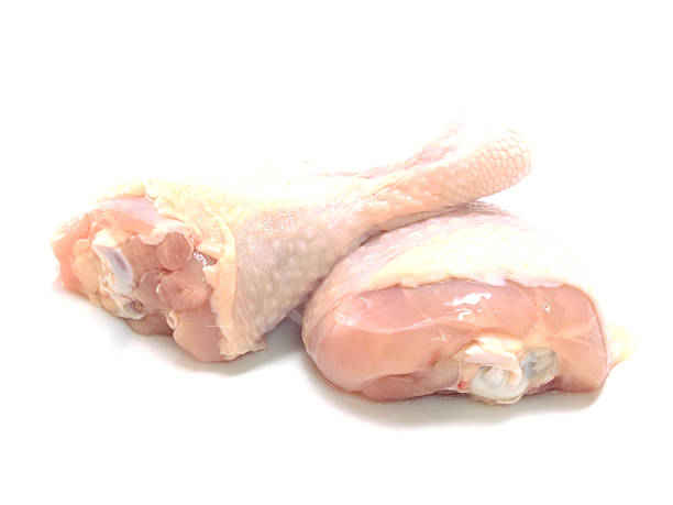 istock raw chicken legs isolated on white background 469989644