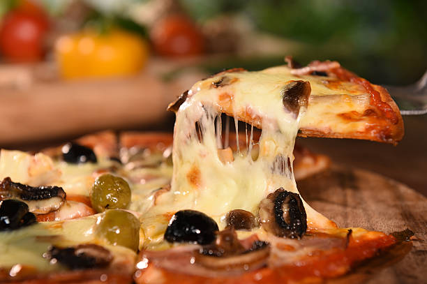 istock pizza on wooden background 469989790