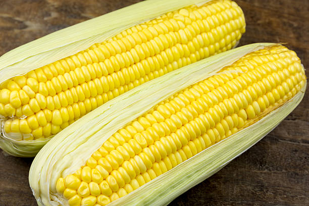 istock Fresh sweet corn on wooden table 469993436
