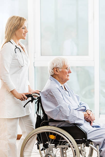 istock Female doctor with a senior patient. 469995469