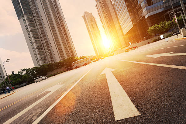 road in city with sunset