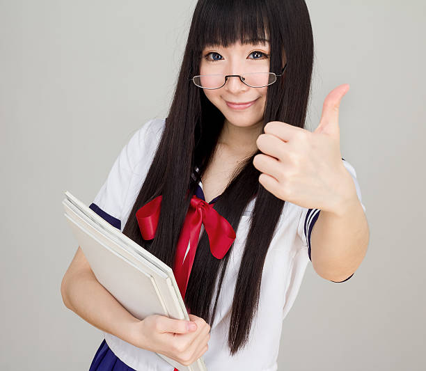 istock asian girl student in school uniform thumb up 469997980