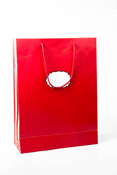 istock red  color paper bags isolated on white. 469998162