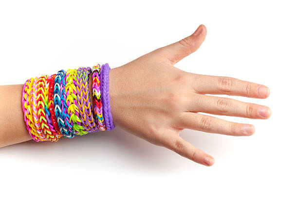 istock Child hand with colorful rubber rainbow loom bracelets 469998256