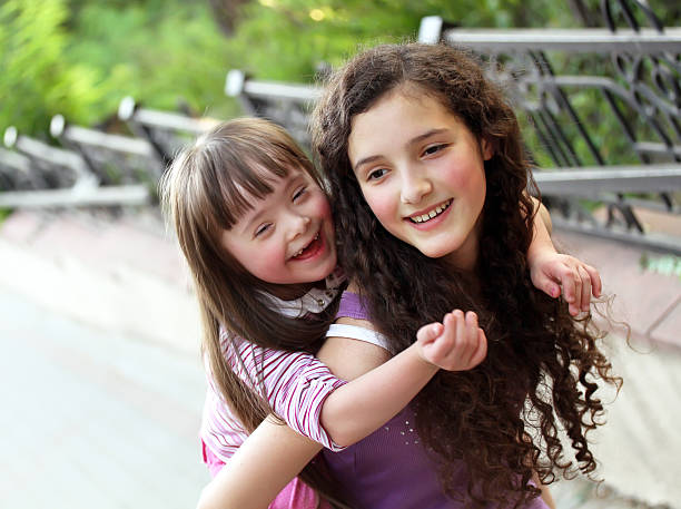 Happy girls Happy girls in the park. sibling stock pictures, royalty-free photos & images