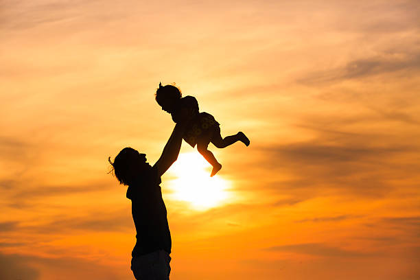 istock Father and little daughter playing at sunset 470002104