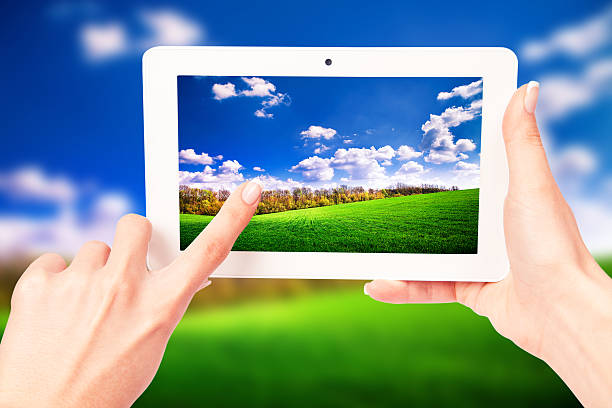 istock tablet computer isolated in a hand on the white backgrounds 470002256