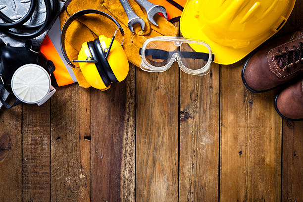 istock Personal safety workwear border on rustic wood background 470005736