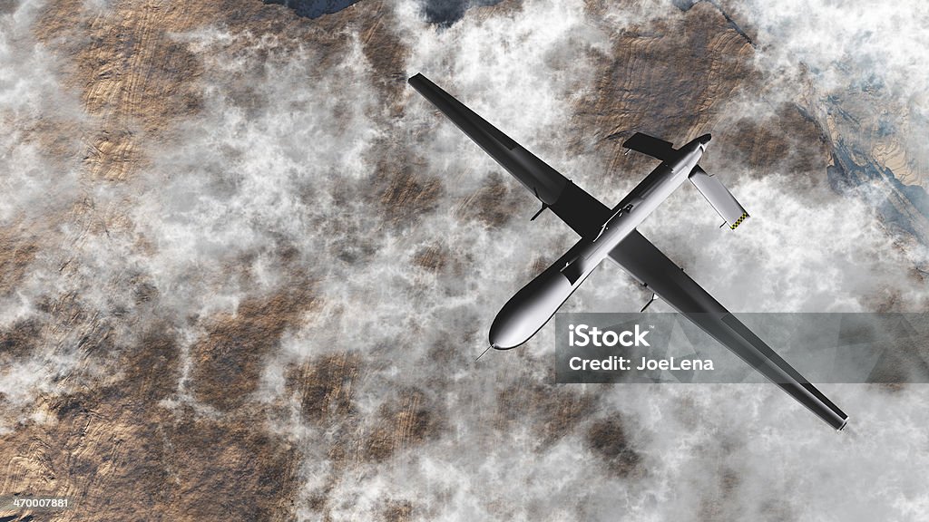 Predator Drone from above, flying over clouds and dessert General Atomics MQ-1 Predator drone flying over the clouds. Drone Stock Photo