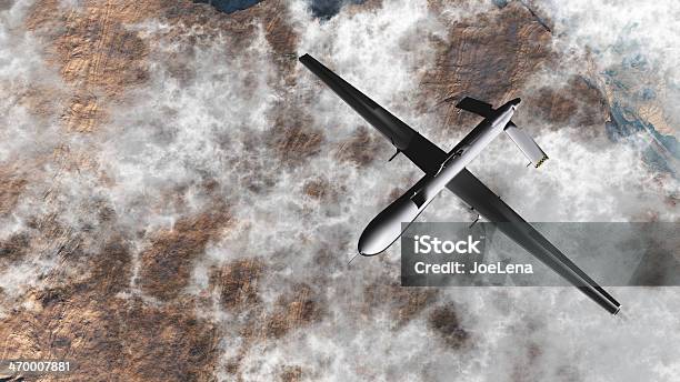Predator Drone From Above Flying Over Clouds And Dessert Stock Photo - Download Image Now