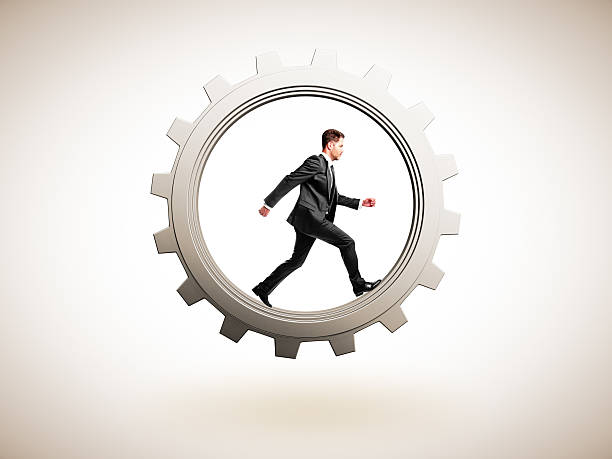 istock businessman runs in gear 470008616