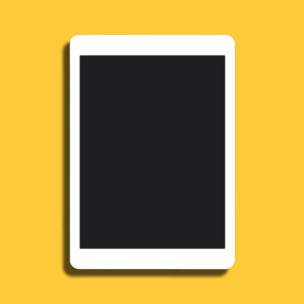 White tablet on yellow background stock photo