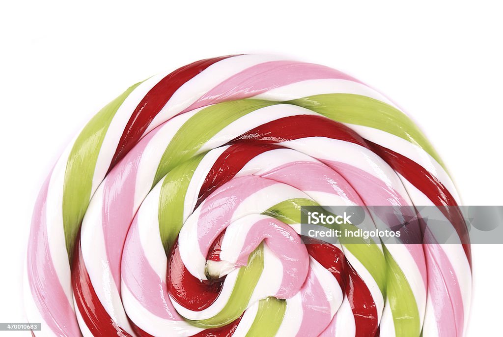 Lovely lollipop with red pinck green Lovely lollipop with red pinck green and white stripes on white background Backgrounds Stock Photo