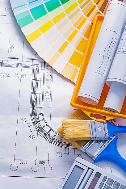 istock composition paintbrushes calculator rolled blueprints in yeelow 470011926