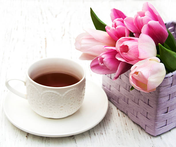 istock Cup of tea and pink tulips 470012674