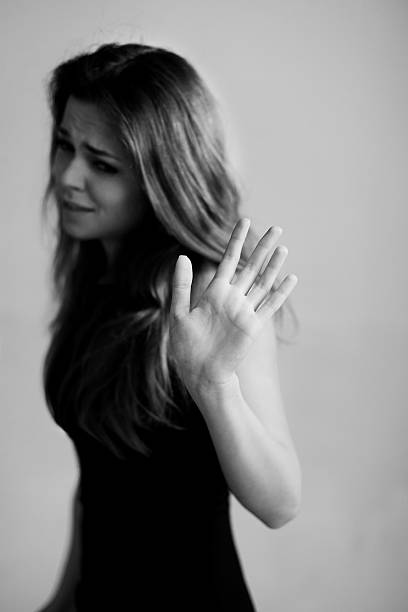 istock women with hand up saying STOP 470013030