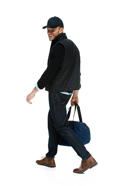 istock Smiling man walking with gym bag 470015845