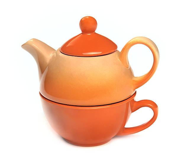 istock Teapot on the teacup on a white background 470020654