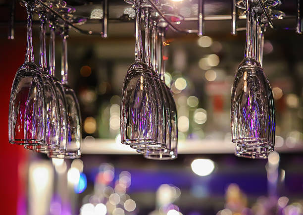 istock glasses on an arm over bar counter 470021758