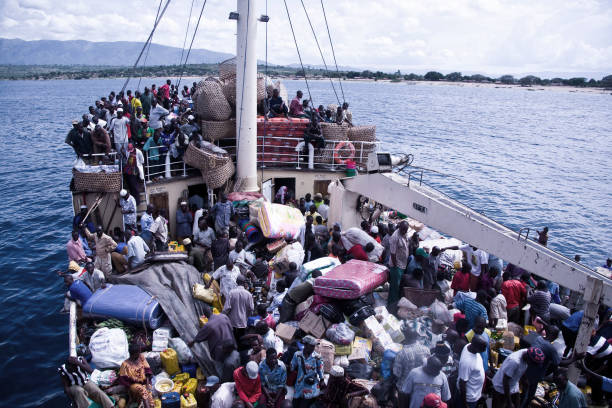 Kigoma, Tanzania - November 23, 2008: Overloaded ship Liemba is leaving the Port of Kigoma on Lake Tanganyika