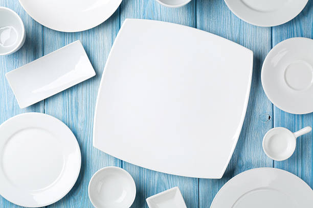 istock Empty plates and bowls on blue wooden background 470022078