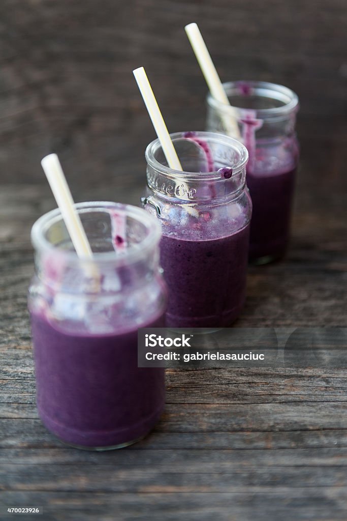 Smoothie Blackberry smoothie on a wooden table 2015 Stock Photo