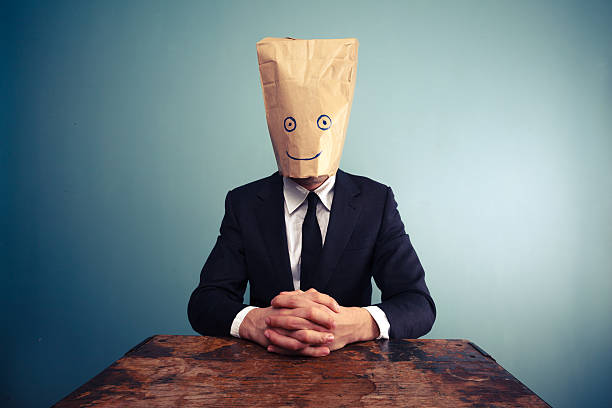 istock Relaxed businessman with bag over head 470024185