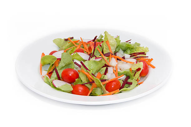 istock fresh vegetable salad isolated on white background 470024356