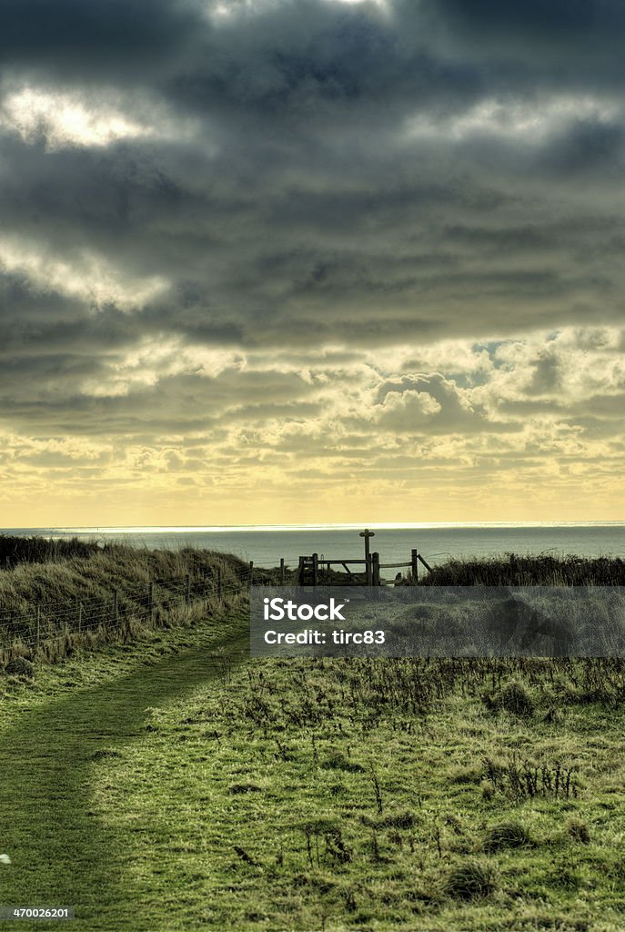 Coastal footpath and gate Agricultural Field Stock Photo