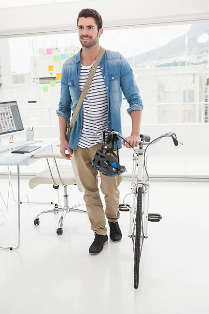 istock Casual businessman with his bicycle 470028658