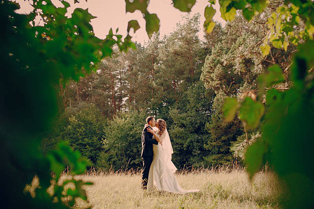 istock Wedding couple in the park 470028864