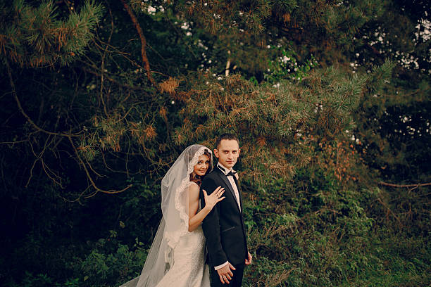 istock Wedding couple in the park 470028868