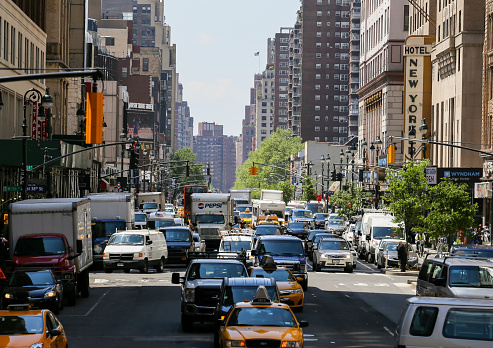 Many cars driving through the jammed streets of new york