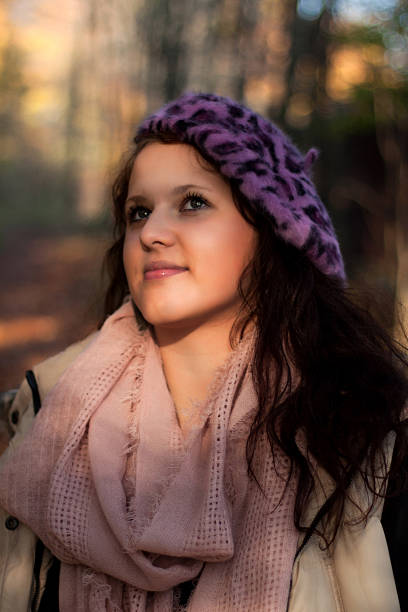 view of a young woman in the sun stock photo