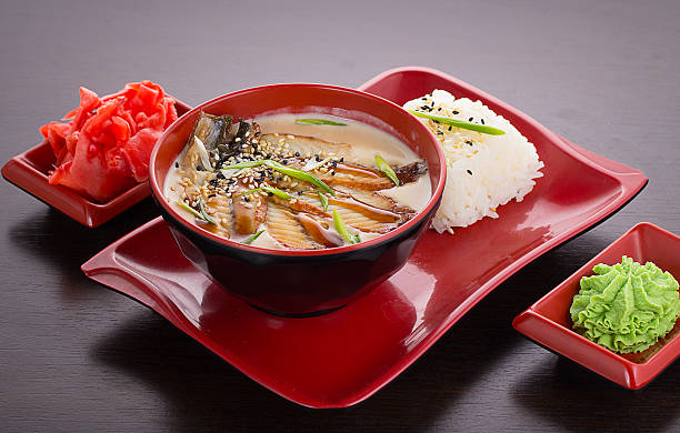 istock Tradisional japanese soup with eel fish in coconut milk 470032446