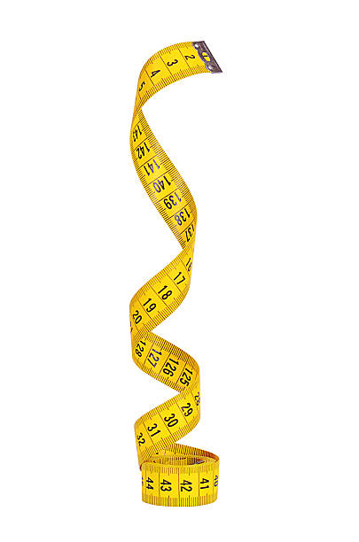 Measuring tape isolated on white background The measuring tape isolated on white background tape measure photos stock pictures, royalty-free photos & images