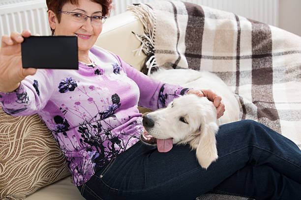 istock Modern senior woman with dog 470040296